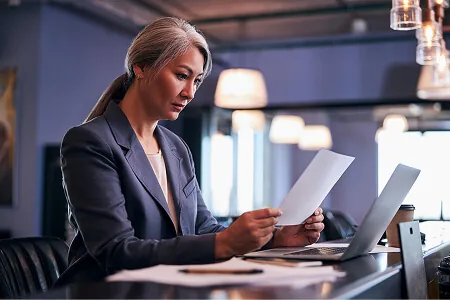 beautiful-businesswoman-studying-project-papers-at-2024-10-21-14-52-31-utc-1